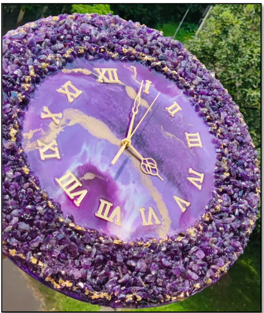 Experience the calm and tranquility of nature with our Amethyst Resin Wall Clock. Made with real amethyst gemstones, this clock not only tells time accurately, but a