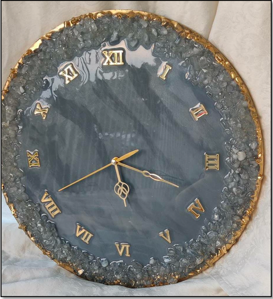 Enhance any room with this stunning Resin Wall Clock adorned with Quartz Crystals. Enjoy precise timekeeping with the quartz movement, while the crystals add a touch